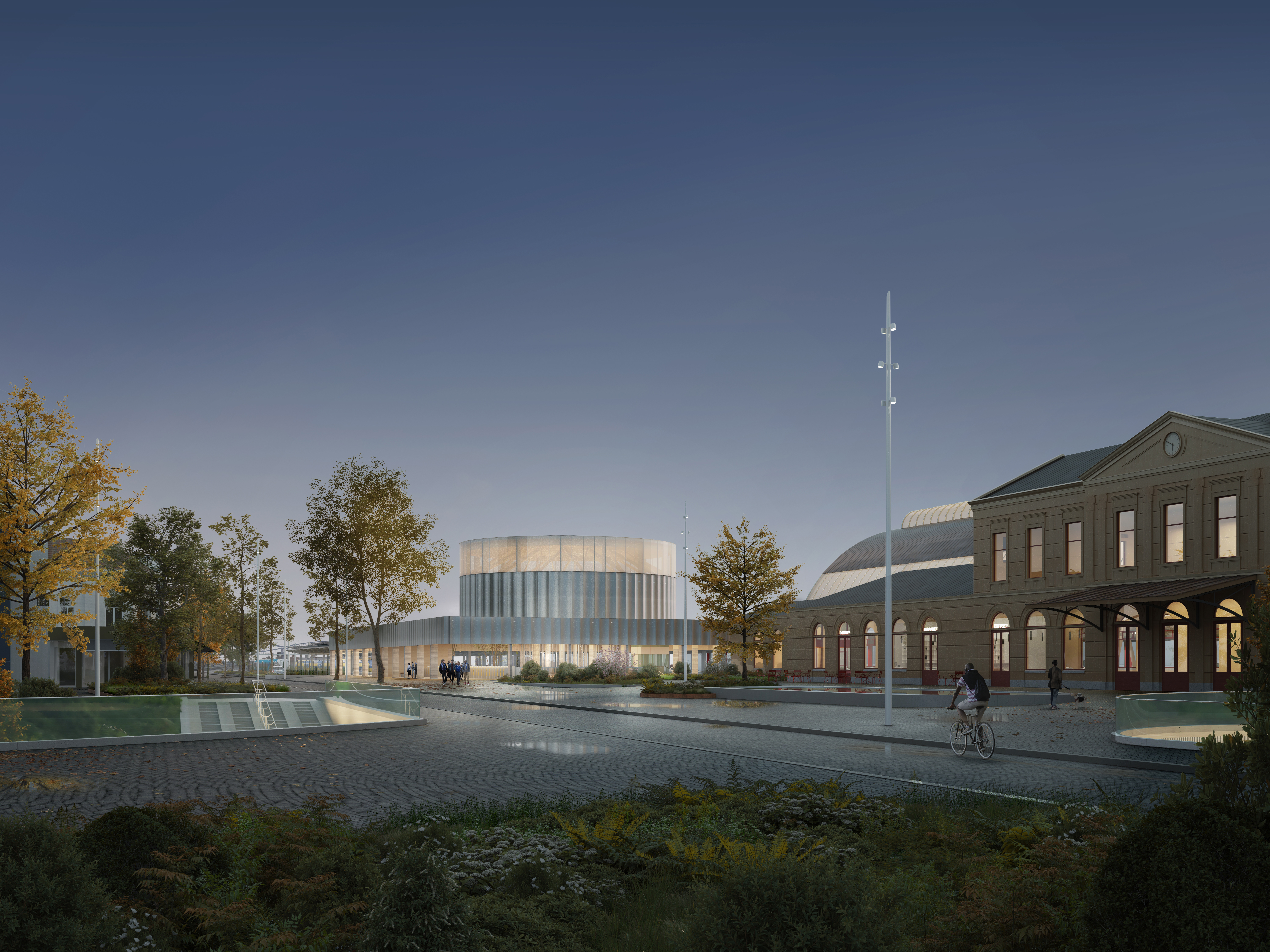 Met zijn hoge en lichte structuur doet de entree denken aan een sfeervolle lantaarn die zowel overdag als 's avonds het station tot leven brengt